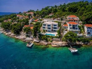 an aerial view of a home on the water at Villa Brac Neptuno - 6 Bedroom Luxury Villa - Sauna - Gym - Sea Views in Selca