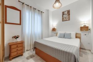 Llit o llits en una habitació de Apartamento centro historico de Malaga