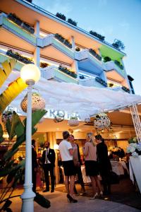 a group of people standing in front of a building at Hotel Aurora in Merano