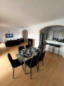 a living room with a dining table and chairs at Bay view Appartment in Paceville