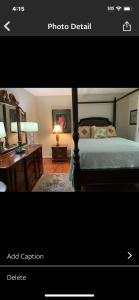 Una foto de un dormitorio con cama y escritorio en A place to stay worry free, en Greensboro