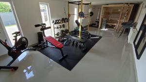 a room with a gym with exercise equipment on the floor at Ferienwohnung Wendel in Sankt Wendel