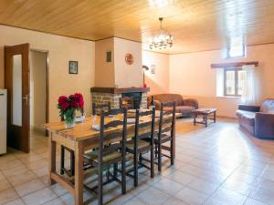 a dining room and living room with a table and a fireplace at Gîte Sauvain, 4 pièces, 6 personnes - FR-1-496-42 in Sauvain