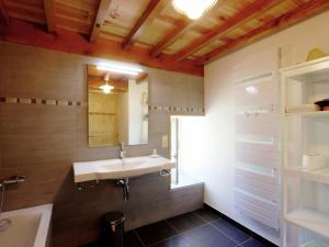 a bathroom with a sink and a tub and a mirror at Gîte La Valla-sur-Rochefort, 5 pièces, 10 personnes - FR-1-496-44 in La Valla