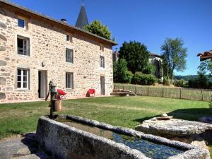 a stone building with a water fountain in front of it at Gîte La Valla-sur-Rochefort, 5 pièces, 10 personnes - FR-1-496-44 in La Valla