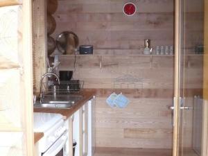 a kitchen with a sink and a counter top at Chalet chaud, nature sauvage, internet PC, idéal randonnées - FR-1-496-184 in Saint-Martin-la-Sauveté