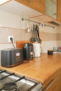 a kitchen counter top with a toaster and a toaster at Kamena kuća in Požega