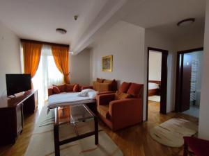 TV a/nebo společenská místnost v ubytování Hotel M3