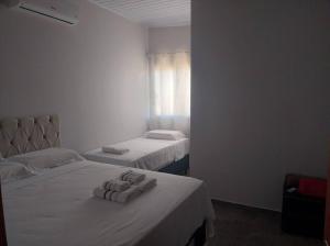 Katil atau katil-katil dalam bilik di Apt novo202 centro ametista do sul +7 gambar
