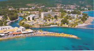 an aerial view of a beach with a resort at River Studios & Apartments in Mesongi +20 photos