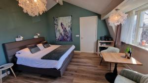 Postel nebo postele na pokoji v ubytování B&B De Droomhoeve