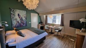 Postel nebo postele na pokoji v ubytování B&B De Droomhoeve