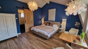 Postel nebo postele na pokoji v ubytování B&B De Droomhoeve