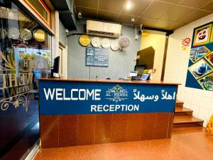 a welcome sign for a restaurant in a store at Al Wehda Hotel in Dubai