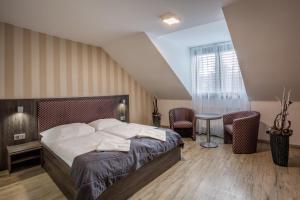Postel nebo postele na pokoji v ubytování Hotel Beta