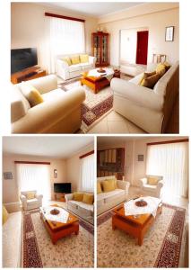 a living room with couches and a table at Tatjana`s Apartment in Sarandë