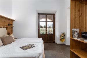 Tuscany Living - Terra Antica客房内的一张或多张床位