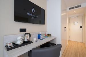 Телевизор и/или развлекательный центр в Óbal Hotel Marbella