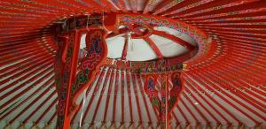a close up of a red umbrella at la yourte du moulin in Champrond