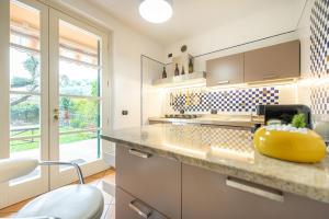 a kitchen with a yellow bowl on the counter at Villa Calmasino - Swimming Pool and Garda Lake in Cavaion Veronese