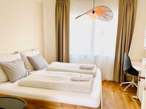 A bed or beds in a room at Appartements BERGTRAUM
