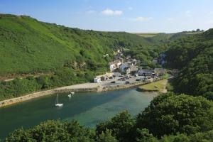 a river with boats in the middle of a town at Ty Gwennol St Davids in St. Davids +8 photos