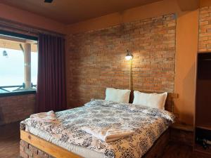 Postelja oz. postelje v sobi nastanitve Nar-Bis Hotel