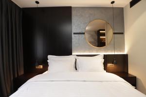 Postel nebo postele na pokoji v ubytování Gremmy Boutique Hotel