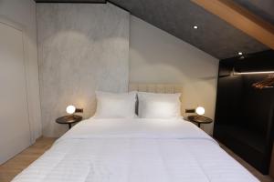Postel nebo postele na pokoji v ubytování Gremmy Boutique Hotel