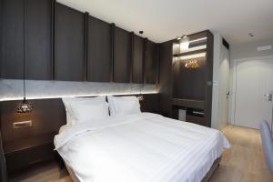 Postel nebo postele na pokoji v ubytování Gremmy Boutique Hotel