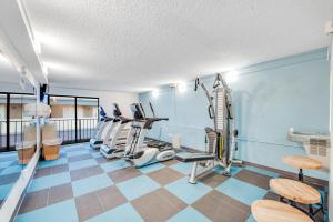 a gym with treadmills and ellipticals in a room at Stylish Oceanview Getaway Modern 1BR at Carolinian Resort" in Myrtle Beach