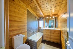 a bathroom with a toilet and a sink and a tub at Casa Torre de les Àligues in Bellver de Cerdanya  +59 photos