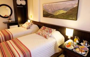Cama ou camas em um quarto em Bogari Hotel