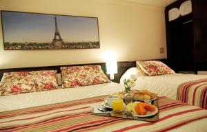 Cama ou camas em um quarto em Bogari Hotel