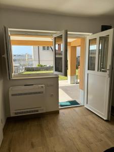 an open door to a room with a window at Trsat-Kampus apartments in Rijeka