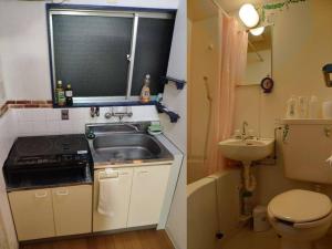 a small bathroom with a sink and a toilet at 2 min from NANBA 16 min from USJ by train in Osaka