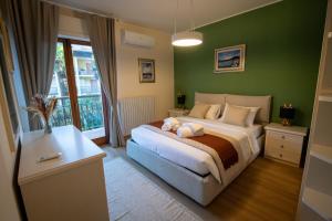 Ένα ή περισσότερα κρεβάτια σε δωμάτιο στο Residenza Lago Sereno