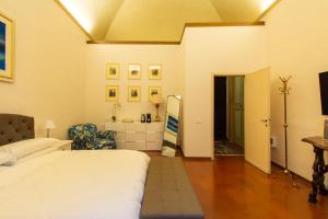 a bedroom with a bed and a bathroom at Maggiore Suite in Perugia