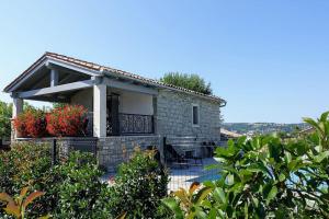 a villa with a swimming pool and a house at Villa Pepa in Pazin
