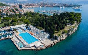 an aerial view of a resort on the water at Beachfront apartment Drazen, with garden in Split