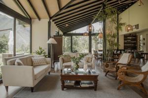 a living room with a couch and a table at Sierra Sacred Valley in Urubamba