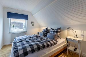 Giường trong phòng chung tại Ferienwohnung Schwennautal