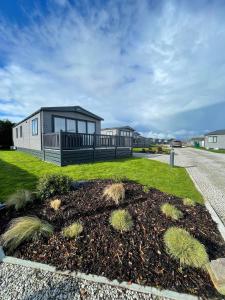 a tiny house on the side of a road at Stones Throw Lodge in Padstow