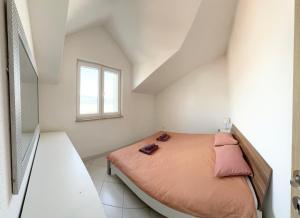 Posteľ alebo postele v izbe v ubytovaní Residence Amore
