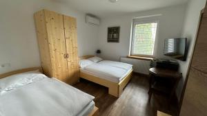 Postel nebo postele na pokoji v ubytování Vila Eva Lesce - Bled