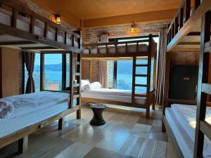Postelja oz. postelje v sobi nastanitve Nar-Bis Hotel