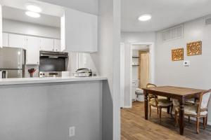 a kitchen and dining room with a table and chairs at Extended Stay Affordable in North Dallas in Dallas