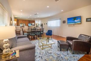 a living room with a couch and a dining room at Stunning huge one level 1350 ft. cottage in Mission Viejo