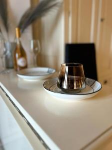 a coffee cup sitting on top of a counter at Airport Residence in Otopeni