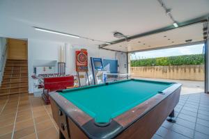 a living room with a pool table in it at Can Vilaveda in Vilanant